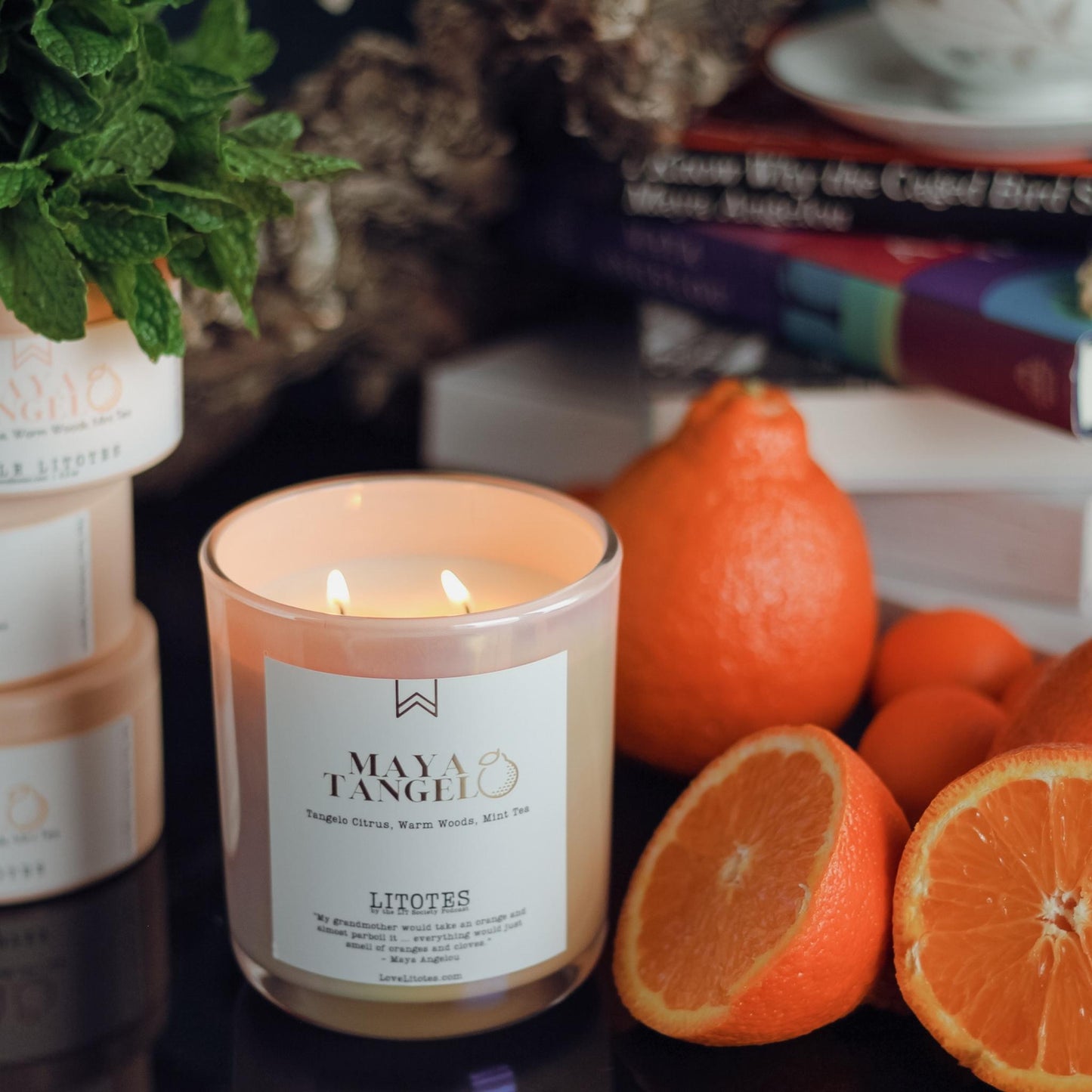 Luxury Soy Candle with the aroma of tangelo citrus, woods, and mint tea. Maya Tangelo, celebrating author Maya Angelou