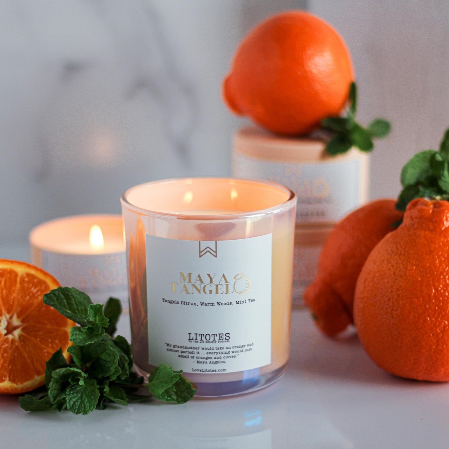 Luxury Soy Candle with the aroma of tangelo citrus, woods, and mint tea. Maya Tangelo, celebrating author Maya Angelou