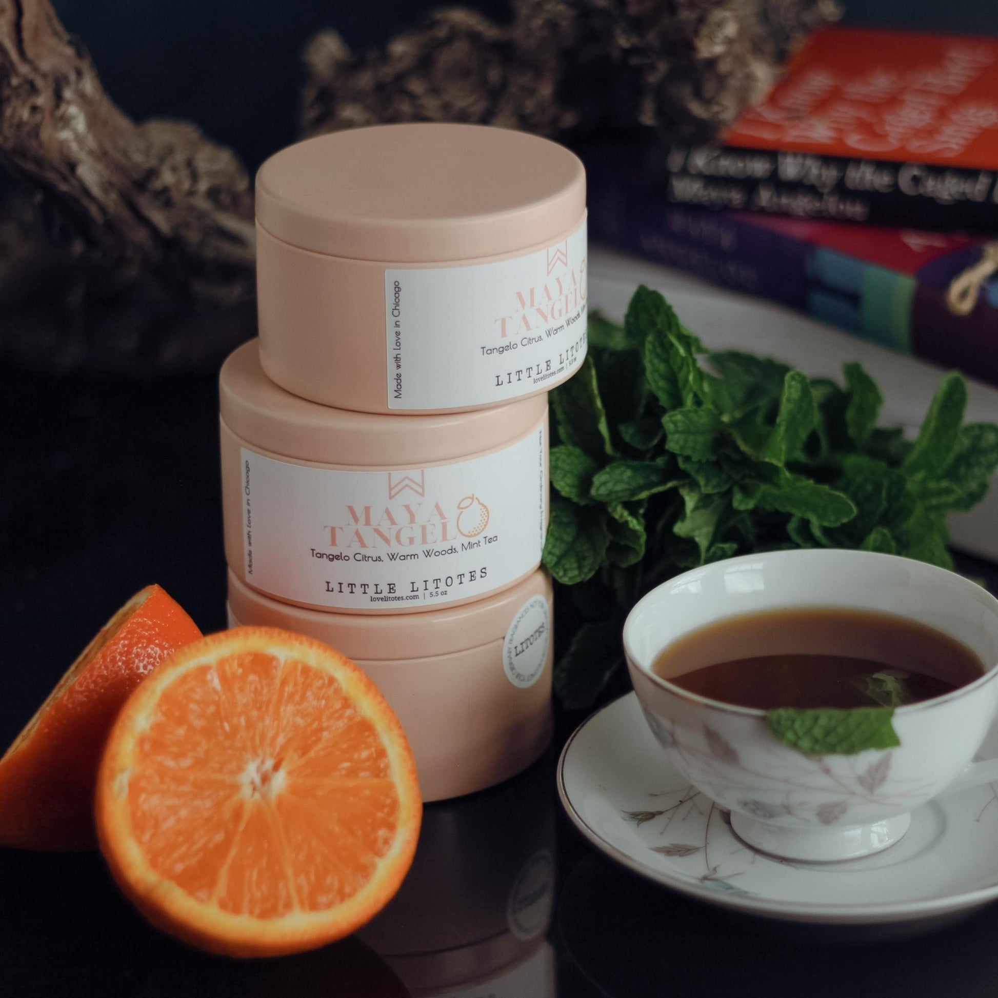 Black-owned, woman-owned, Chicago-made luxury soy candle with tangelo citrus, woods, and mint tea aroma. Celebrating the work and life of Maya Angelou, candles handcrafted in small batches.